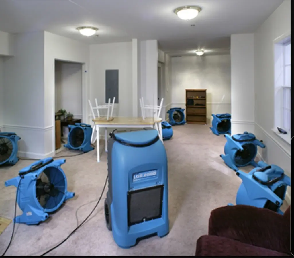 Air movers and dehumidifier setup for Water Damage Restoration in Holland